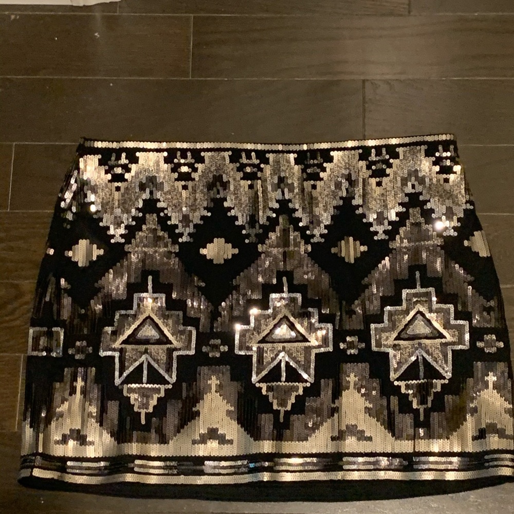 NWOT Express Black and Gold mini skirt, size L